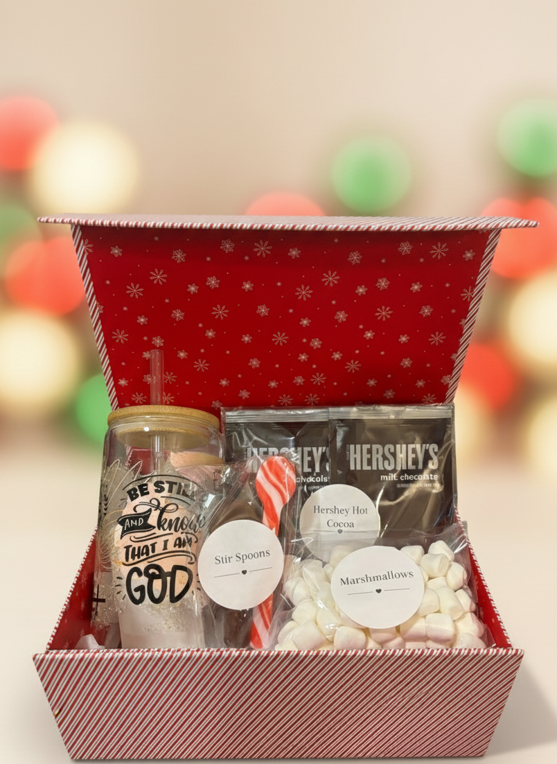 Holiday hot cocoa gift box contents shown for example only. Cup design may vary